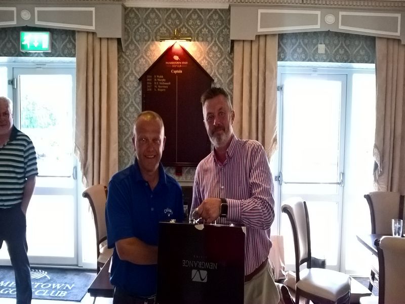 Palmerstown  winner Kieran McGurran (left). Captain Martin Blake presenting.